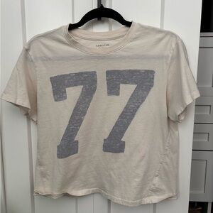 American Eagle Cream T-Shirt with Gray 77 Print